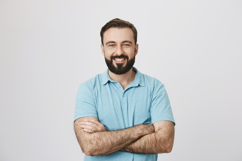 handsome confident smiling man with hands crossed chest